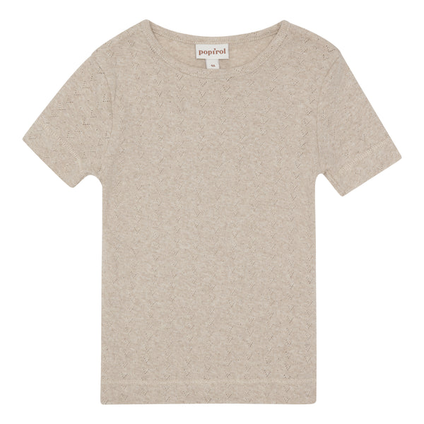 Popirol Pinja T-shirt til pige med korte ærmer i økologisk bomuld. T-shirten er beige og har hulmønster.